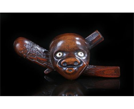 Meiji period boxwood Netsuke No mask of  with a slapstick and club, with signature to club 9cm wide