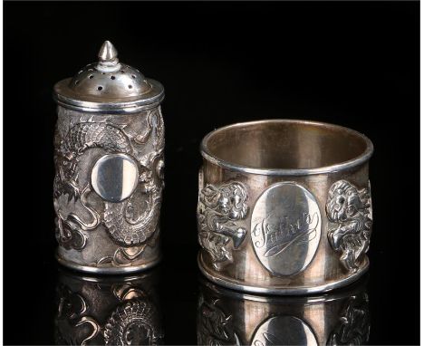 Chinese silver pepper pot and napkin ring the pepper pot decorated with a dragon chasing a pearl, the napkin ring with two dr