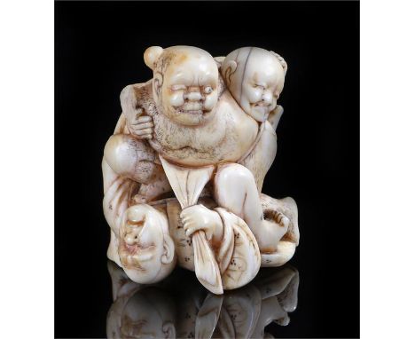 Japanese Edo period netsuke group, carved as three blind men struggling, 5cm high