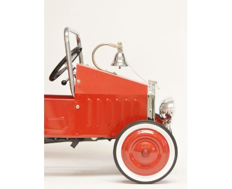 A modern tinplate fire engine pedal car "FD", red paintwork with chrome fittings, having white wall tyres, alarm bell to bonn