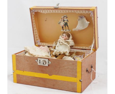 An S.F.B.J. bisque head doll, incised "301 Paris", light brown short wig, painted eyes, bent limb composition body, height 16