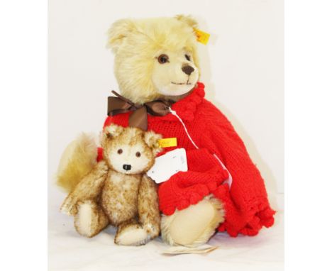 A modern Steiff teddy bear, serial no. 010354, golden mohair, with button, tag and labels attached, height 36cm, dressed in k