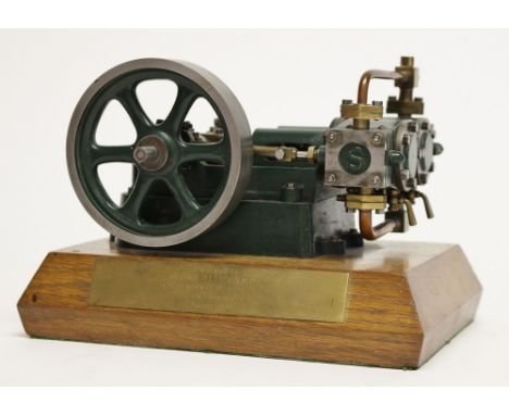 Stuart Turner: A Stuart twin-cylinder Horizontal Stationary Steam Engine mounted on a presentation wooden plinth. 18cm width.