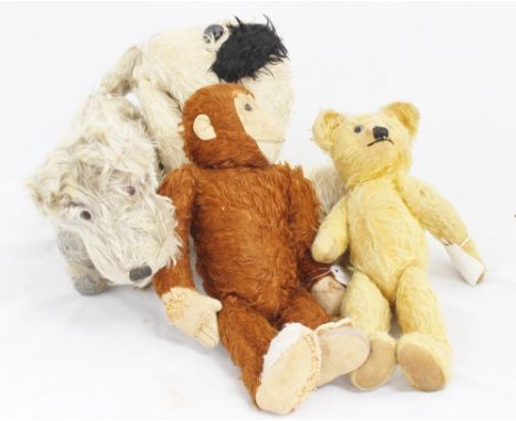 Three vintage soft toys comprising a golden plush teddy, a monkey and a dog, one possibly Steiff, all much loved and a dog py