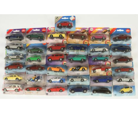 Siku Group Of 36 To Include - Jaguar XJ6, Audi A6 Avant, Porsche 959 plus others - conditions are Near Mint to Mint on Fair t