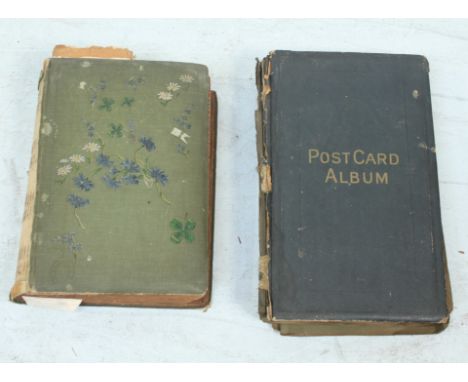 A large quantity of postcards across two albums, including topographical, portrait and comical interests among others.