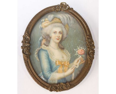 An early 20th century painted oval miniature portrait of a lady in a fine blue dress, with ostrich feathers in her hair, sign