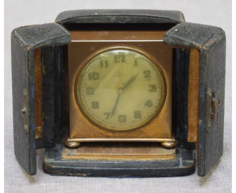 A Zenith small travel alarm clock, plain gilt brass square case, and original velvet-lined black leather travel case, 7cm hig