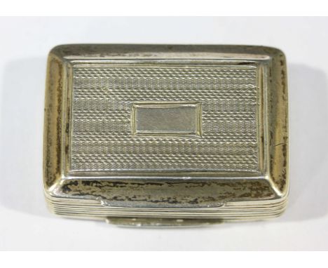 A George IV silver and silver-gilt vinaigrette, rectangular form, engine-turned hinged top and base, reeded sides, hinged and