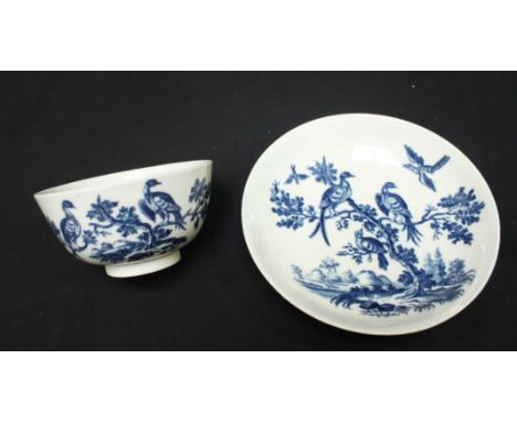 An 18th century Worcester porcelain tea bowl and saucer printed in under-glaze blue with the 'Bird in a Tree' pattern, cresce