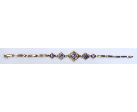 A Victorian 9ct gold, amethyst and pearl bracelet, with a symmetrical design, on expanding bracelet. Gross weight approximate