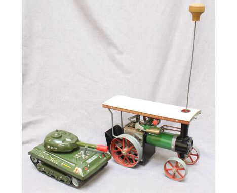 A Mamod traction steam engine, without box, together with a Stick shift US army tank in original box