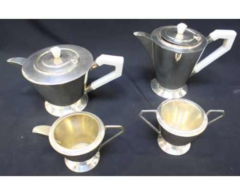 A four-piece Art Deco silver-plated tea set of inverted tapering cylindrical form with angular white composite handles, compr