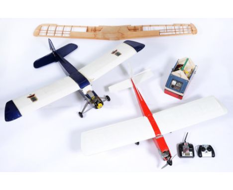 Two painted balsa wood model aircraft, with Enya or other engine and related remote control installation and controllers Sold