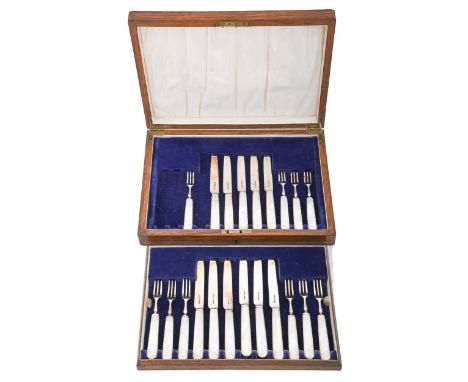 A set of eleven George V mother of pearl hafted silver dessert knives and ten forks, by George Bishop &amp; Sons, Sheffield 1