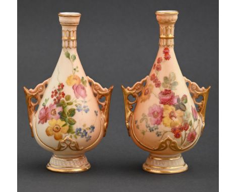 Two Royal Worcester vases, 1898 and circa, with pierced handles, printed and painted with wild flowers on a shaded apricot gr