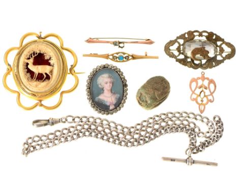 A paste locket, an Egyptian faience scarab amulet, a Victorian carved bone and giltmetal brooch, a silver Albert, two gem set