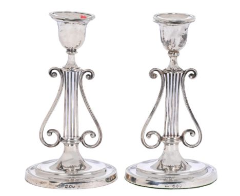 A pair of Victorian silver lyre candlesticks, on oval foot, nozzles, 20.5cm h, by Harrison Brothers &amp; Howson, London 1894
