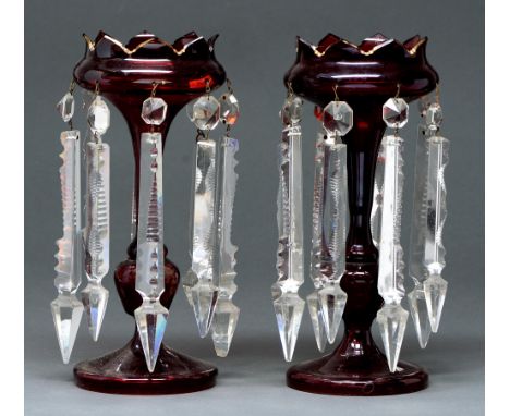 A pair of ruby glass lustres, late 19th c, with gilt rim and prismatic cut glass beads and pendants, 29cm h Gilding rubbed on