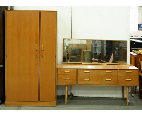 A Stag mid-century modern light wood wardrobe and dressing table with mirror, c1960, wardrobe 177cm h; 56 x 91cm Good conditi