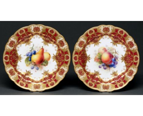 A pair of Royal Worcester dessert plates, 1911, painted by F Roberts, both signed, with fruit in claret and gilt border with 