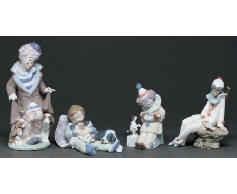 Two Lladro figures of clowns and another of a sleeping boy, various sizes, printed marks and a Nao figure of a Pierrot (4) Go