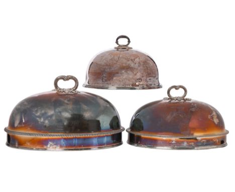 A graduated pair of Old Sheffield Plate gadrooned&nbsp; dish covers, crested, 35 and 40cm l and a smaller EPNS dish cover (3)