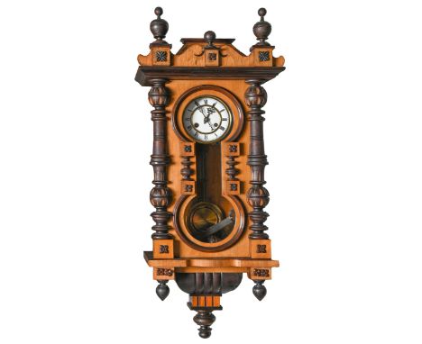 A German walnut and ebonised Vienna wall clock, c1900, with enamel dial and gridiron pendulum, 87cm h Dusty but complete and 