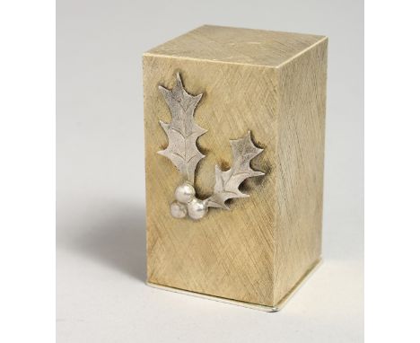 A STUART DEVLIN SILVER BOXED ANGEL AND HOLLY, 1974. 2.5ins.
