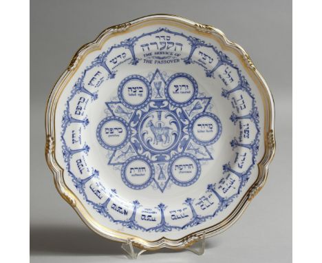 A SPODE BONE CHINA PASSOVER PLATE in blue with gilt borders. 10.5ins diameter.