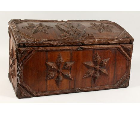 A GOOD TRAMP ART CARVED WOOD, DOMED TOP BOX, carved with a ladder, tools and star motif. 22ins x 12ins.