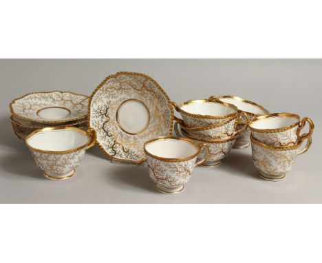 A WORCESTER FLIGHT BARR AND BARR set of six gadroon bordered tea cup and saucers and three coffee cups deacorated with seawee