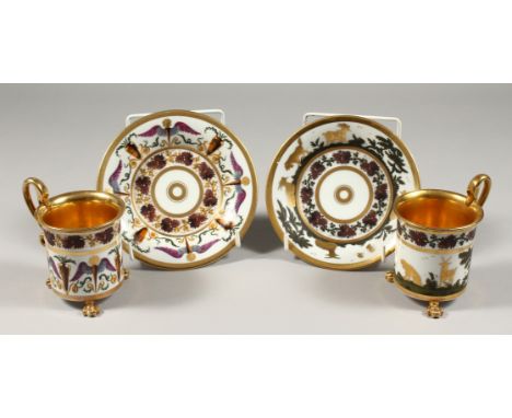 A GOOD PAIR OF 19TH CENTURY FRENCH PORCELAIN CUPS AND SAUCERS, one with gilt dog and goats the other with wings.