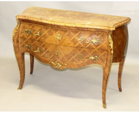 A GOOD LOUIS XVI DESIGN SERPENTINE FRONTED KINGWOOD COMMODE, with a variegated marble top over two long drawers with ormolu h