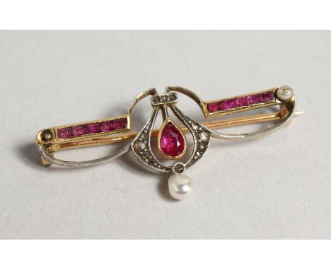 AN EDWARDIAN RUBY DIAMOND AND PEARL BAR BROOCH.