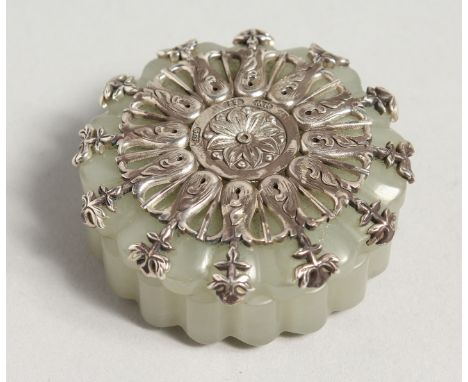 A SMALL RUSSIAN SILVER TOP CIRCULAR JADE BOX AND COVER. Stamped H.W. 84 5925. 2ins diameter.