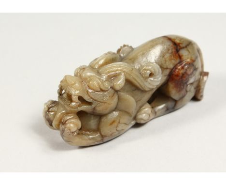 A CARVED JADE DOG OF FOU, 4ins long.