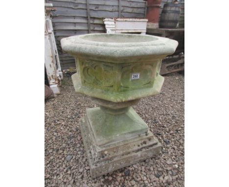 Large stone planter on plinth