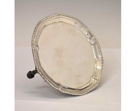 George III silver card tray of circular form, having a gadrooned rim and standing on three cast feet, engraved beneath in cur
