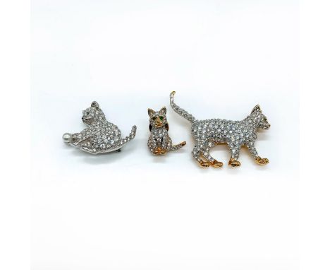 The 1st cat is gold plated with clear crystals and a green crystal eye measuring 2.25"L x 2"W. The 2nd cat is miniature and g