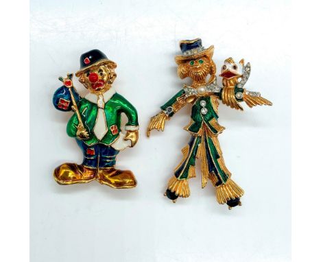 Colorful figural scarecrow with bird perched on outstretched arm measures 2.5"L x 1.75"W. Colorful clown with hobo bag on a s