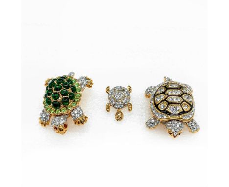 All of the brooches are gold plated with Swarovski backstamps. The first turtle has clear, red, and green crystals and caboch