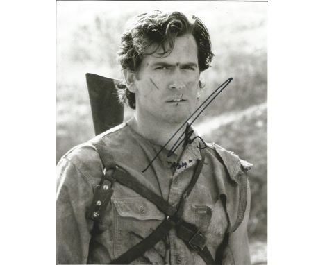 Bruce Campbell The Evil Dead hand signed 10x8 photo. This beautiful hand signed photo depicts Bruce Campbell as Ash in the hi