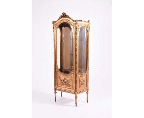 A Louis XV style giltwood vitrine, 20th centuryThe arched cresting carved with flowers and foliage above a single glazed door