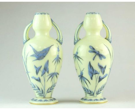 A pair of French glass vasescirca 1880of double gourd twin-handled from, the pale yellow glass decorated in low relief in blu