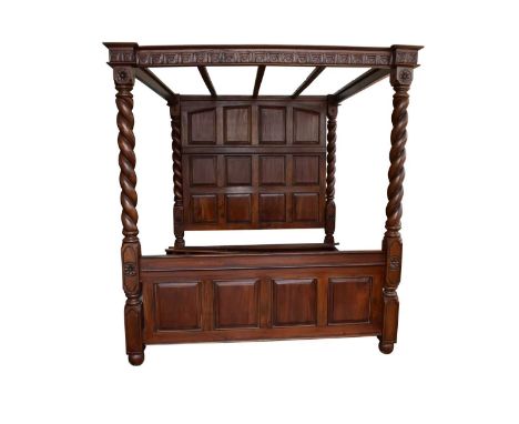 A reproduction mahogany four-poster bedOf 17th century influence, the canopy with leaf-moulded cornice, above the twelve-pane