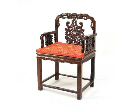 A Chinese carved rosewood armchair, Qing Dynasty, late 19th centuryThe scroll-carved top rail above an openwork splat with sh