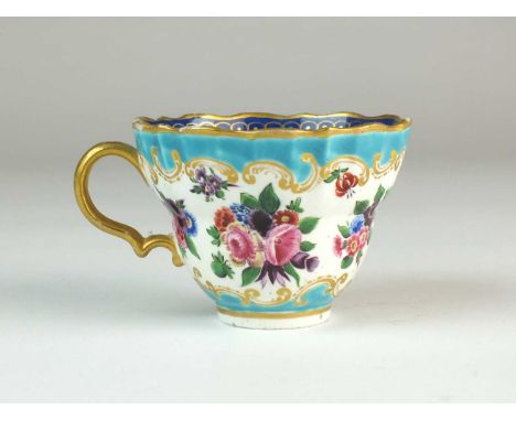 A large Caughley caudle cupcirca 1775-80of half-fluted, waisted form, boldly painted in polychrome with a single butterfly an