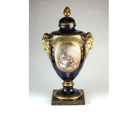 A large French twin-handled ornamental vase and cover20th centurywith twin rams-head handles, painted with an oval panel of t