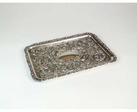 An Edwardian silver dressing table tray, Levi &amp; Salaman, Birmingham 1906, of rectangular form with embossed grape, vine a